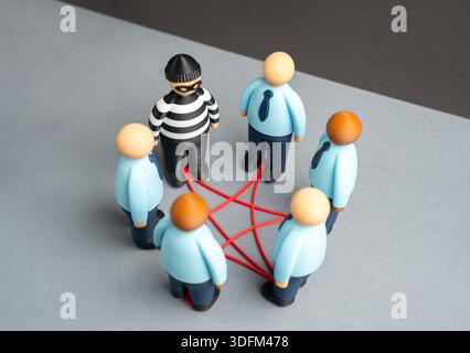 An insider on the team. Theft of confidential corporate information. A spy among the employees. Insider threat risk, data leaks and corporate espionag Stock Photo