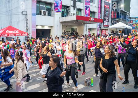 large outdoor dance fitness event, dance class, on a street in the Baguio city, Philippines, communal activity promoting wellness and unity Stock Photo