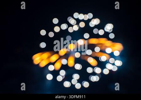 fireworks exploding in the night sky, presented with a bokeh effect Stock Photo