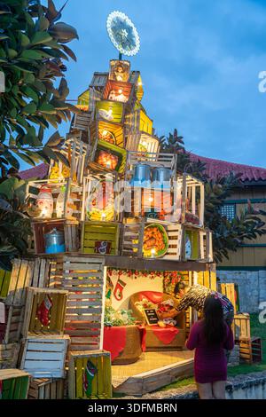 Christmas tree display, outdoor sculpture, made of wooden boxes with gifts, Cebu city, Philippines Stock Photo