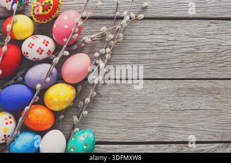 Colorful Easter Eggs Arranged With Delicate Branches on a Rustic Wooden Table Stock Photo