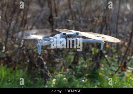 DJI Mini3 drone flying. Stock Photo