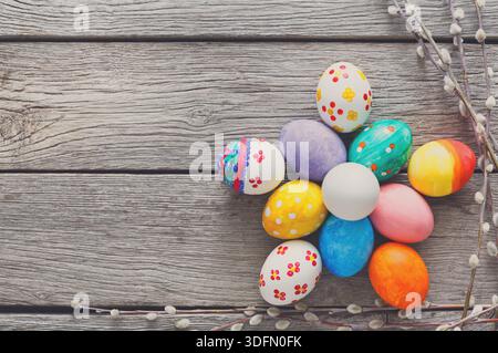 Colorful Decorated Easter Eggs Arranged on a Wooden Table With Spring Decor Stock Photo