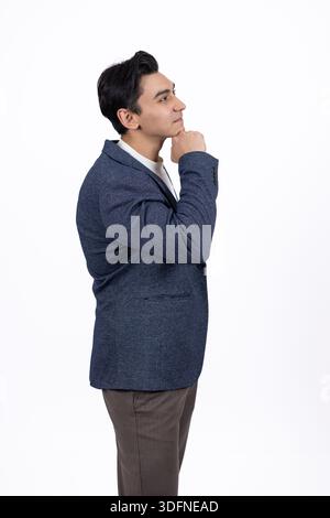 Thoughtful man touching his chin Stock Photo