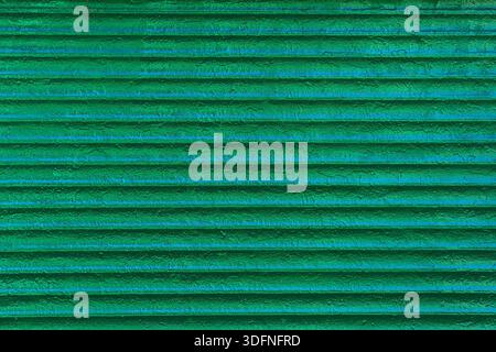 Striped surface covered with green paint. Abstract geometric pattern. Stock Photo