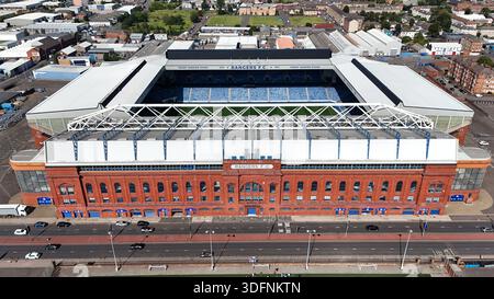 Aerial view of Ibrox Stadium, the home ground of Rangers FC, showing the historic red-brick main stand and surrounding urban area in Glasgow. Daytime Stock Photo