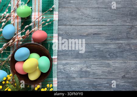 Colorful Easter Eggs Arranged on a Wooden Table With Festive Decorations and Flowers Stock Photo