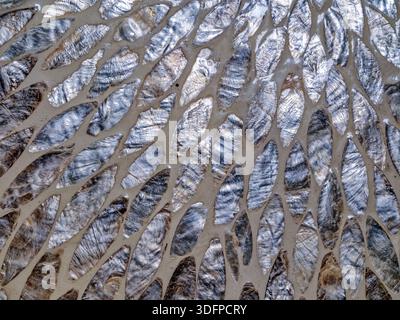Details of mother-of-pearl pieces inlaid in an abstract mosaic design Stock Photo