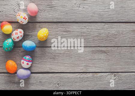Colorful Easter Eggs Arranged on a Wooden Surface Ready for Celebration and Decoration Stock Photo