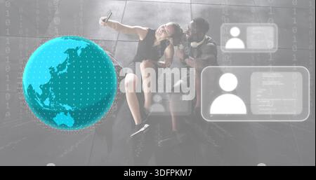 Taking selfie couple wearing black dress and T-shirt, holding phone in lobby with AR globe Stock Photo