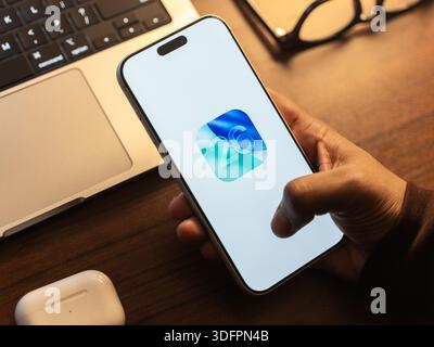 IOS 26 logo is displayed on the screen of a smartphone, in Bangalore, India, on January 14, 2026 Stock Photo