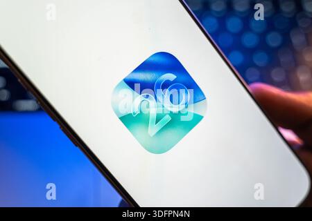 IOS 26 logo is displayed on the screen of a smartphone, in Bangalore, India, on January 14, 2026 Stock Photo