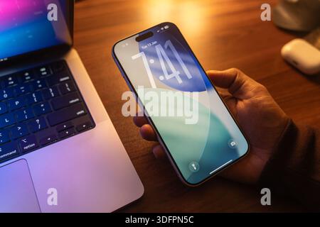 IOS 26 logo is displayed on the screen of a smartphone, in Bangalore, India, on January 14, 2026 Stock Photo
