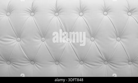 White tufted leather upholstery background with buttons creating a seamless pattern and texture Stock Photo