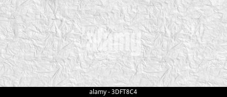 Crumpled white paper surface creating an abstract texture background Stock Photo