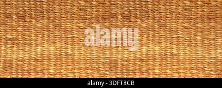 Brown natural fiber creating a detailed woven wicker basketry texture Stock Photo