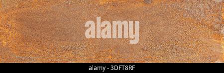 Rusty metal surface displaying textured corrosion and brown-orange colors Stock Photo
