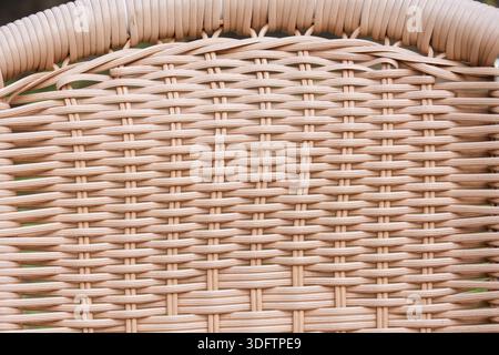 Natural and organic beige woven rattan texture with intricate geometric pattern showing calm and peaceful craftsmanship of handmade wicker material fo Stock Photo
