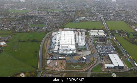 Aerial view of the sprawling datacenter complex, a modern grid against the patchwork of green fields and distant town, Waltham Cross, United Kingdom. Stock Photo