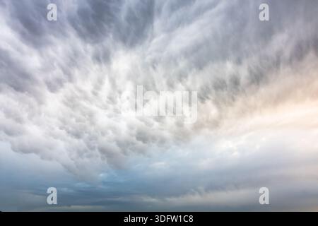 fluffy clouds covering the sky before a storm. Severe weather forecast concept photo Stock Photo