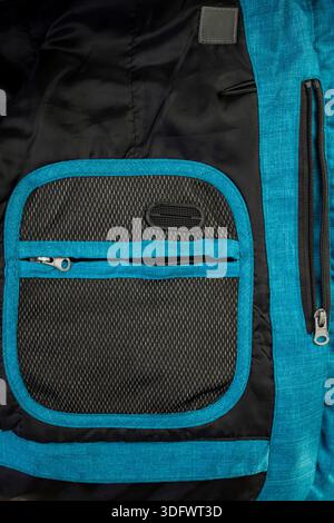 Internal mesh pocket and zipper of a jacket or backpack, highlighting the functional design and material detail Stock Photo