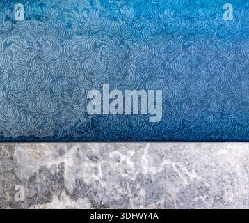 detailed image of a swimming pool with a marble edge and patterned blue interior Stock Photo