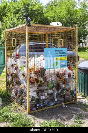 Novokuybyshevsk, Russia - July 3, 2020: Container for collecting plastic bottles of various drinks for recycling. Text in russian: Container for plast Stock Photo