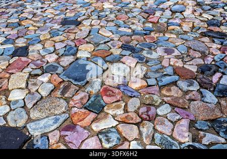 Old cobblestone roadway as creative background texture Stock Photo