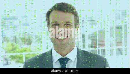 Smiling businessman wearing dark suit, white shirt, dark tie on balcony, with green binary overlay Stock Photo