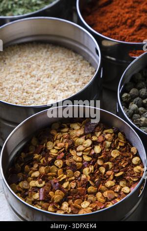 Dried color chili flakes in steel bowl Stock Photo