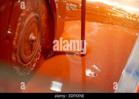 Chocolate machine. Industrial stirring of chocolate. Machines in chocolate factory stir the chocolate mixture in stainless steel containers Stock Photo