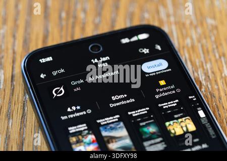 Closeup on Google Play install screen for xAI Humorous AI assistant for social media platform X. Concept: generative AI, manipulated images, chatbot Stock Photo