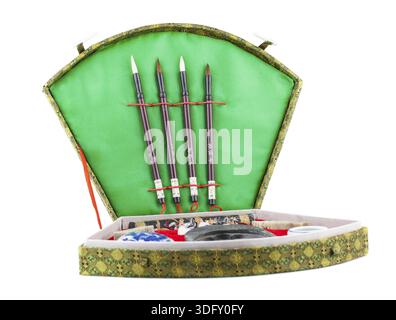 Chinese calligraphy set with brushes in box. Isolated on white background Stock Photo