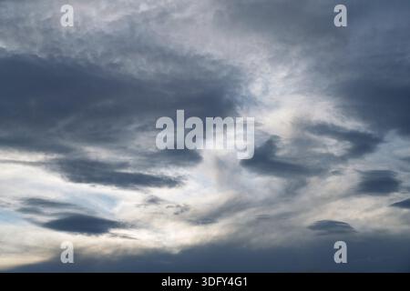 A threatening grey cloudy evening sky. Stock Photo