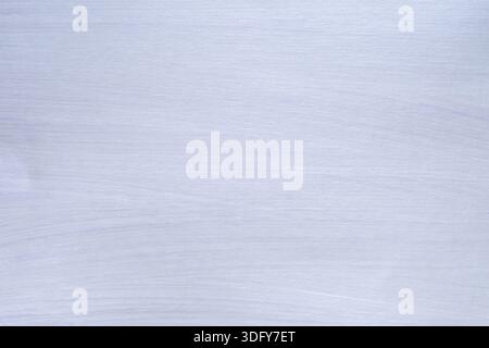 A background with a light blue textured surface reminiscent of watercolor on linen or canvas, with a soft gradient creating depth. The minimalist desi Stock Photo