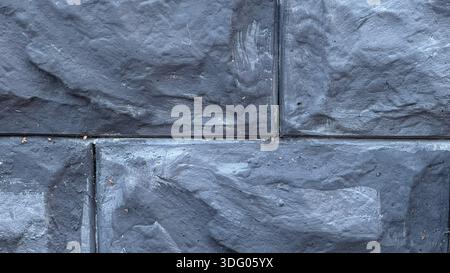 Textured Dark Gray Stone Wall for Modern Architecture Stock Photo