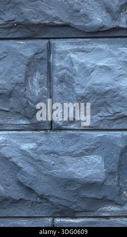 Textured Dark Gray Stone Wall Surface for Modern Design Projects Stock Photo