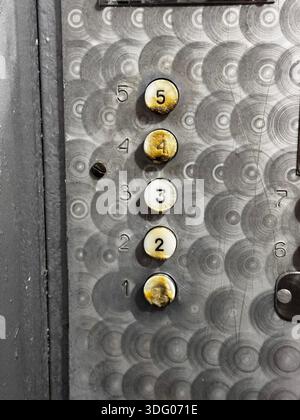Vintage Elevator Buttons with Worn Numbers and Textures Stock Photo