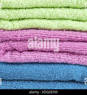 Stack of the multicolored towels Stock Photo