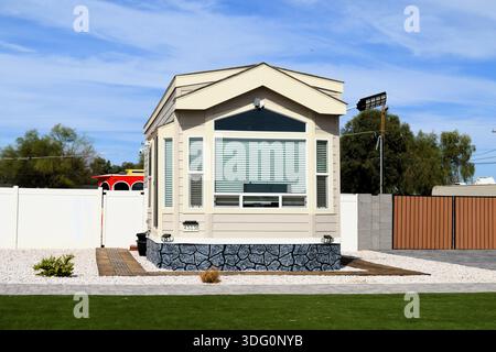 Newly built tiny home positioned on a compact city lot in Arizona, illustrating efficient urban housing. Stock Photo