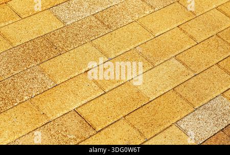 Yellow ceramic paving stones as background texture close up Stock Photo
