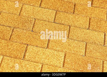 Yellow ceramic paving stones as background texture close up Stock Photo
