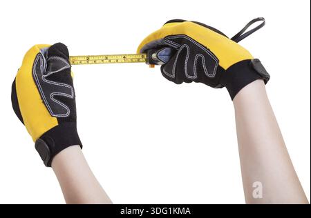 Builder hands in protective glowes with tape measure isolated on white background Stock Photo