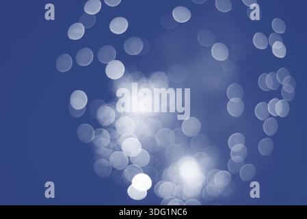 Defocused festive lights inclassic blue. Can be used as background Stock Photo