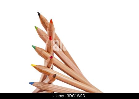 Creatively stacked pencils of different colors on white Stock Photo
