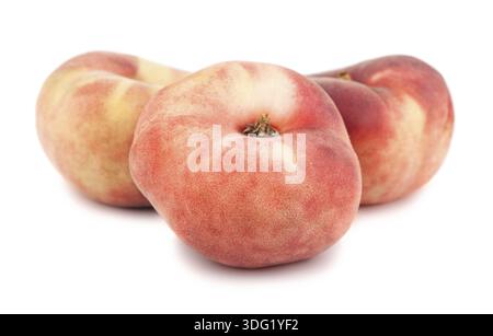 Three paraguayos flat peaches isolated on white background Stock Photo