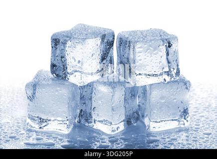 Five melted ice cubes with water drops on white background Stock Photo