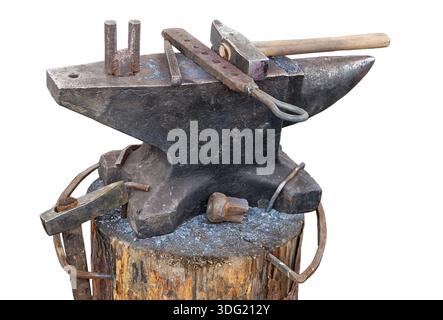 Old anvil with blacksmith tools isolated on white background Stock Photo