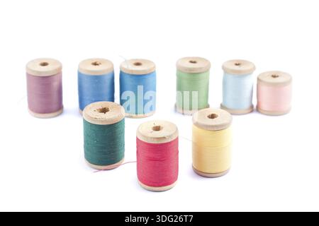 different colors thread spools isolated on white background Stock Photo ...