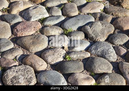 Old paved roadway as background closeup Stock Photo